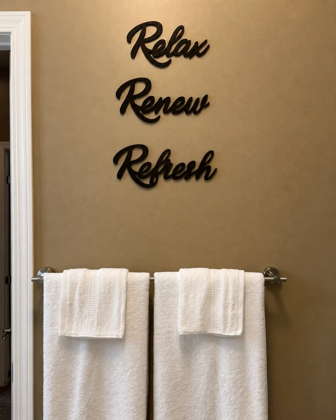 Fresh towels on the bathroom towel bar